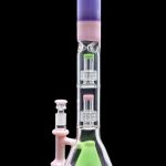 Pink and green glass bong with intricate percolators.