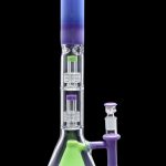 Purple and green glass bong with intricate percolators.