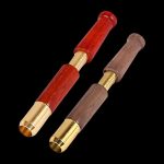 Close-up of the Single Hitter Ejector Taster Bat, showing its cylindrical shape and detailed metal accents against a dark background.