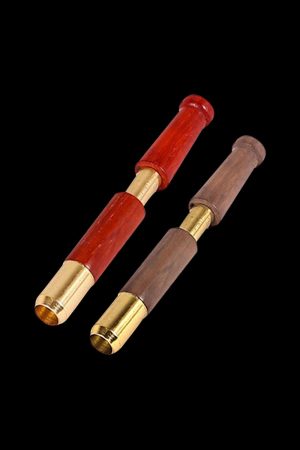 Close-up of the Single Hitter Ejector Taster Bat, showing its cylindrical shape and detailed metal accents against a dark background.