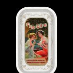 Vintage Zig-Zag rolling paper tin featuring an ornate design of two women in early 20th-century attire.
