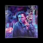 Neon-lit glass tray depicting a man smoking, with futuristic cityscapes and digital circuit patterns in a purple and blue color scheme.