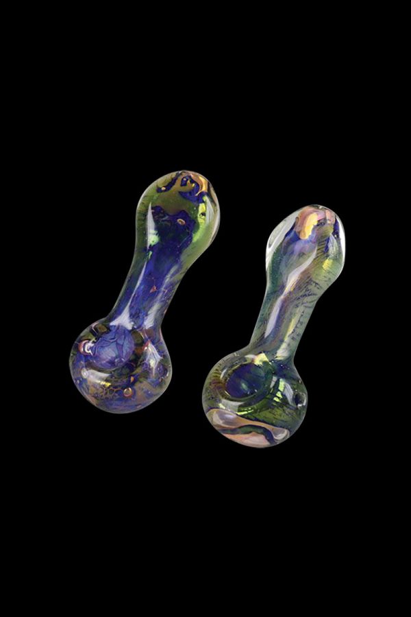 A close-up, angled view of the Spattered Fumed Hand Pipe, showcasing its colorful, glass construction against a dark background.