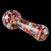A close-up shot of the Splatter Frit Glass Hand Pipe, featuring colorful frit patterns on clear glass.