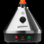 Front view of the silver Storz & Bickel Volcano Classic Vaporizer, displaying its dial and conical shape against a dark backdrop.