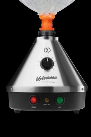 Front view of the silver Storz & Bickel Volcano Classic Vaporizer, displaying its dial and conical shape against a dark backdrop.