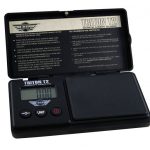 Close-up of the MyWeigh Triton T2 200g x 0.01g Scale, showing its open lid and digital display against a white instructional background.