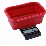 A close-up, angled view of the Truweigh Crimson Collapsible Bowl Scale, displaying a digital readout on its small, red weighing platform.