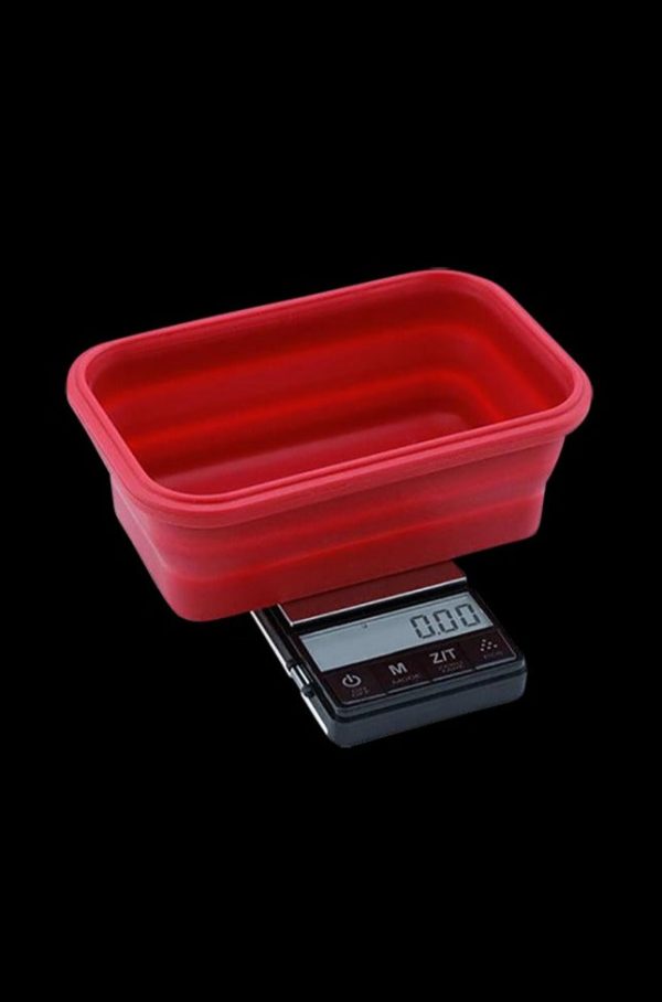 A close-up shows the Truweigh Crimson Collapsible Bowl Scale with a digital readout, angled against a dark backdrop.