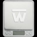 Front view of the Truweigh Enigma Digital Mini Scale, displaying a black screen and silver buttons on a white surface.