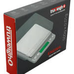 A slightly angled close-up of the Truweigh Enigma Digital Mini Scale, showcasing its compact size and digital display.