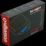 Front view of the Truweigh Lynx Digital Mini Scale, displaying a digital readout on its sleek, black surface.