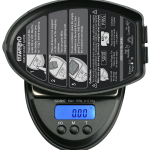 Close-up, top-down view of the Truweigh Sonic Digital Mini Scale, displaying a digital readout on its silver surface.