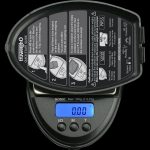 Close-up of the Truweigh Sonic Digital Mini Scale displaying a zero reading, with instructional text visible on its surface.