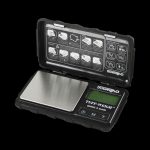 A close-up, top-down view of the Truweigh Tuff-Weigh Mini Scale with a black and silver design, showcasing its digital display.