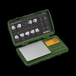 A close-up, angled view of the Truweigh Tuff-Weigh Mini Scale with a digital display and black casing on a white surface.