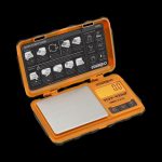 A top-down view of the open Truweigh Tuff-Weigh Mini Scale, displaying a quick start guide and calibration instructions.