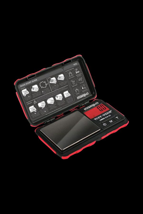 A top-down view of the Truweigh Tuff-Weigh Mini Scale, showcasing its digital display and open lid on a dark surface.
