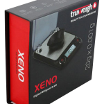 Front view of the Truweigh Xeno Digital Milligram Scale, displaying a sleek black design with a bright digital readout.