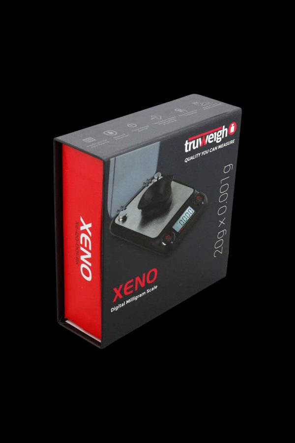 A close-up, angled view of the Truweigh Xeno Digital Milligram Scale displaying its sleek, minimalist design and digital readout.