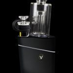 Black cannabis vaporizer with a glass bubbler attachment.
