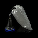 A black cannabis vaporizer with a translucent, inflated vapor bag attached, displayed against a dark background.