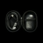 Open black carrying case with a cannabis vaporizer and charging cable inside.