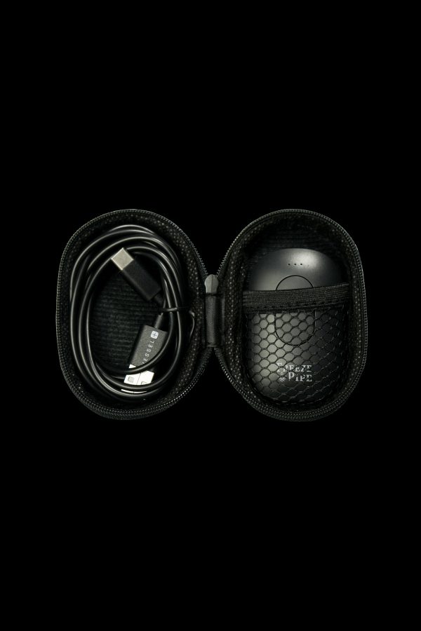 Open black carrying case with a cannabis vaporizer and charging cable inside.
