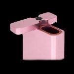 Pink one-hitter pipe with an open end, isolated on a black background.