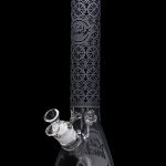 A glass bong with a flared base, patterned black neck, and clear glass throughout.