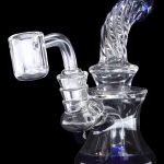 Clear glass dab rig with blue accents and quartz banger.