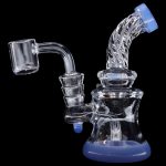 Blue glass dab rig with quartz banger, isolated on black.