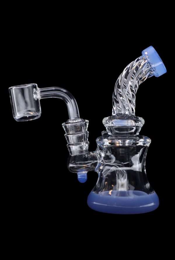 Blue glass dab rig with quartz banger, isolated on black.
