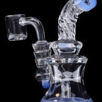 Blue and clear glass dab rig with quartz banger.