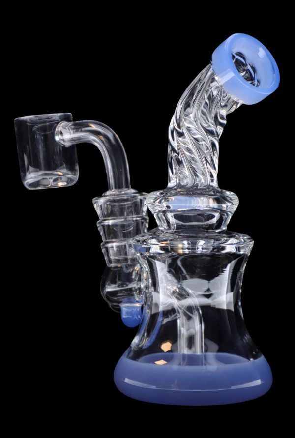 Blue and clear glass dab rig with quartz banger.