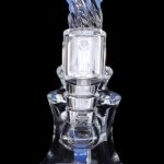 Blue glass dab rig with intricate percolator design.