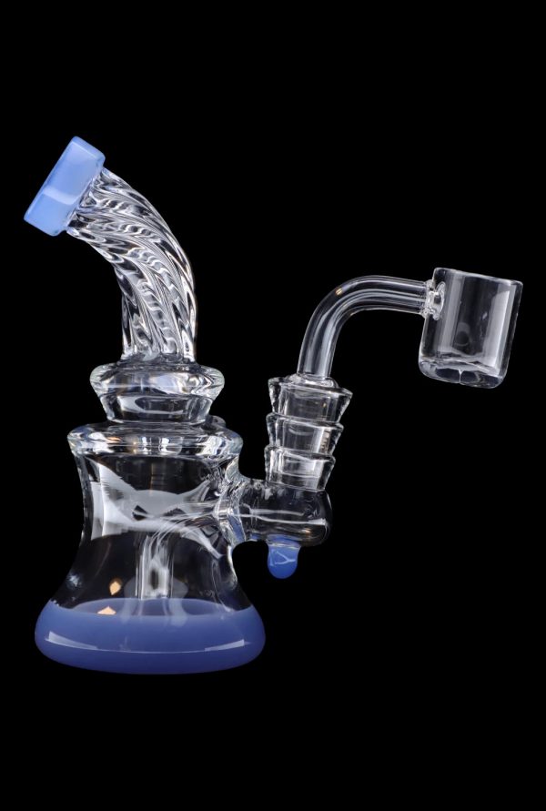 Blue and clear glass dab rig with a quartz banger.