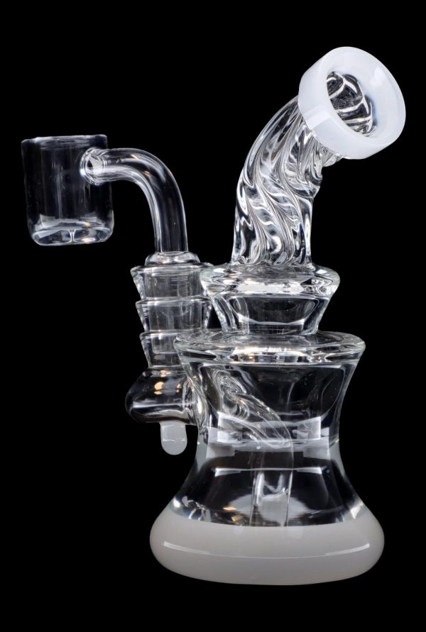 Clear glass dab rig with quartz banger, isolated on a black background.