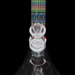 Colorful glass water pipe with percolators, studio shot on a black background.