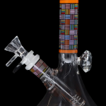 Glass water pipe with colorful geometric patterns, isolated on black.