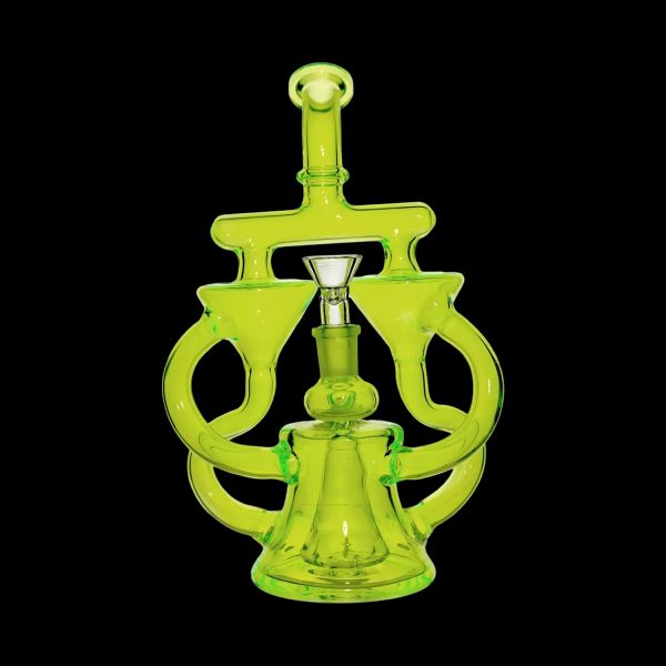 Green glass dab rig with intricate looping design.