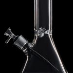 Clear glass bong isolated on a black background.