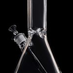 Clear glass bong with a flared base and angled neck, isolated on a black background.