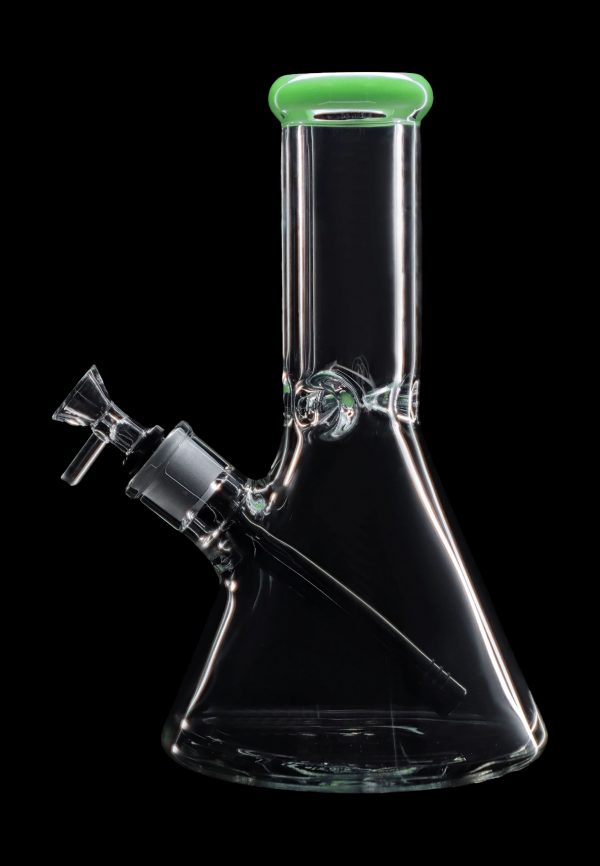 Clear glass bong with green accents, isolated on a black background.