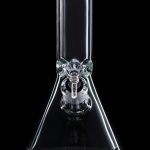 Clear glass bong with a green rim and ice catcher, isolated on black.
