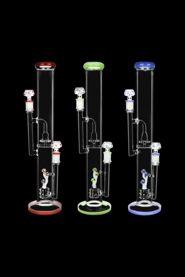 Three glass bongs with colorful accents, isolated on a black background.