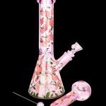 Pink glass bong with peach design and accompanying bowl piece.