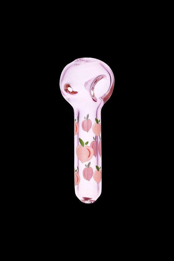 Pink glass pipe with peach pattern against a black background.