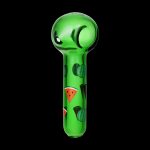 Green glass pipe decorated with watermelon slices against a black background.