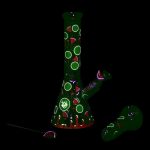Green glass bong with watermelon pattern, isolated on black.